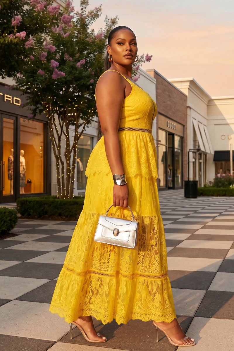 Woman in a yellow dress holding a white handbag on a shopping street.