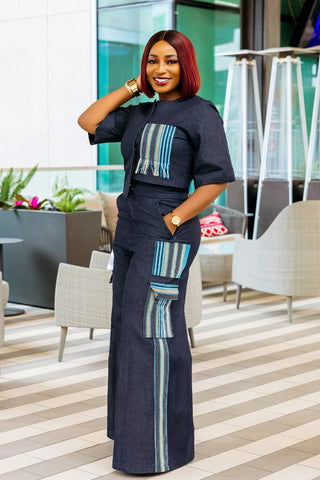 Woman in a stylish outfit with blue and white patterns in an indoor setting