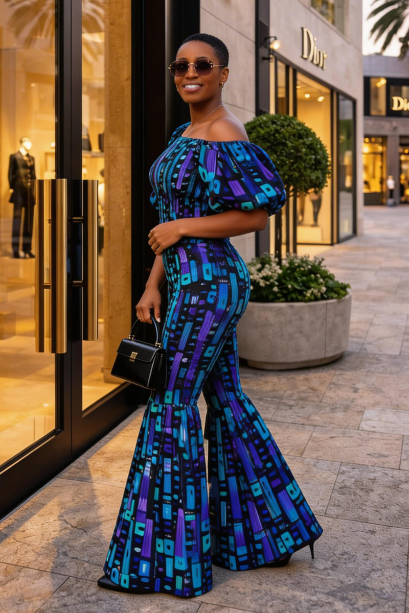 Woman in a blue and black patterned dress standing in front of a Dior store.