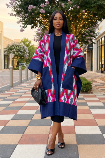 Woman wearing a colorful patterned coat in an outdoor setting