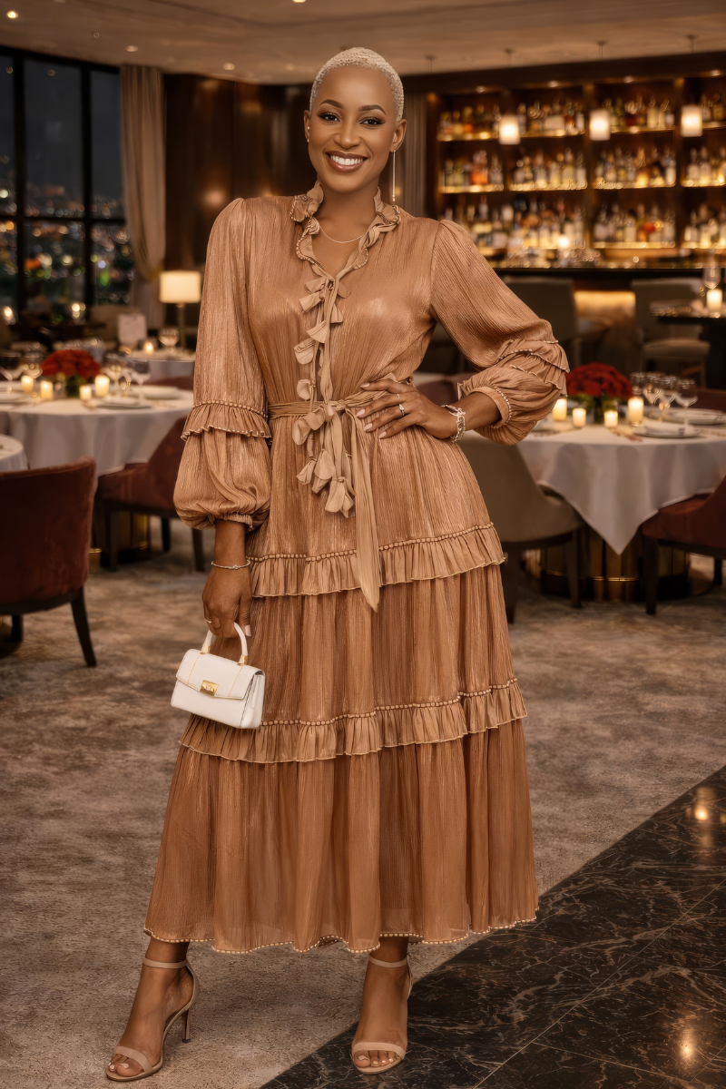 Woman in a beige dress standing in a restaurant with tables and decor.